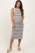 woman wearing a black and white striped maternity tank dress and holding her baby bump