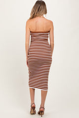 woman wearing a brown and white striped midi strapless maternity dress, showing a side view of the back