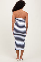 woman wearing a navy and white striped strapless midi dress, showing the back view