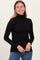 woman wearing a black long sleeve turtleneck top with a slim fit and smiling