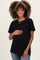 woman wearing a black short sleeve maternity top and showing her baby bump