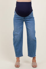 maternity wear dark blue high-waisted jeans with a stretchy belly panel, styled with a relaxed fit