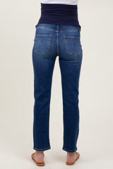 woman wearing dark blue maternity jeans from the back, featuring a comfortable waistband and slim fit