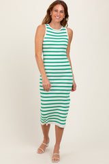 woman wearing a white and green stripe midi dress with a sleeveless design and a fitted silhouette