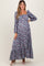 woman wearing a pink and purple floral maternity maxi dress with puff sleeves and a square neckline, showing her baby bump