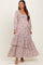 woman wearing a floral print maternity maxi dress with a smocked bodice and tiered ruffles, showing her baby bump