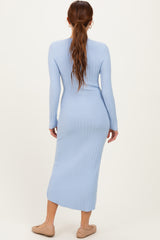 woman wearing a light blue ribbed midi dress with long sleeves and a fitted silhouette, viewed from the back