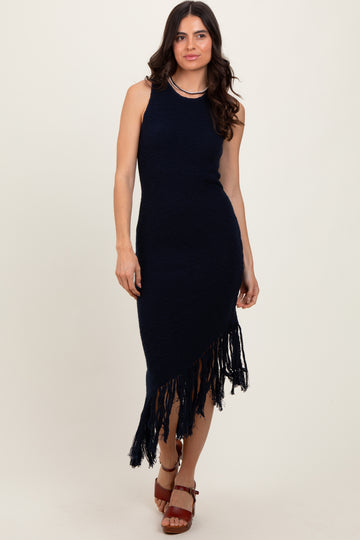woman wearing a navy blue knitted maxi dress with fringe hem and a fitted silhouette.