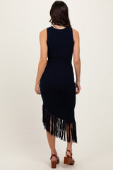 woman wearing a navy knitted dress with a fringe hem and a fitted silhouette, seen from the back