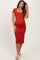 woman wearing a rust-colored short sleeve maternity dress hugging her baby bump