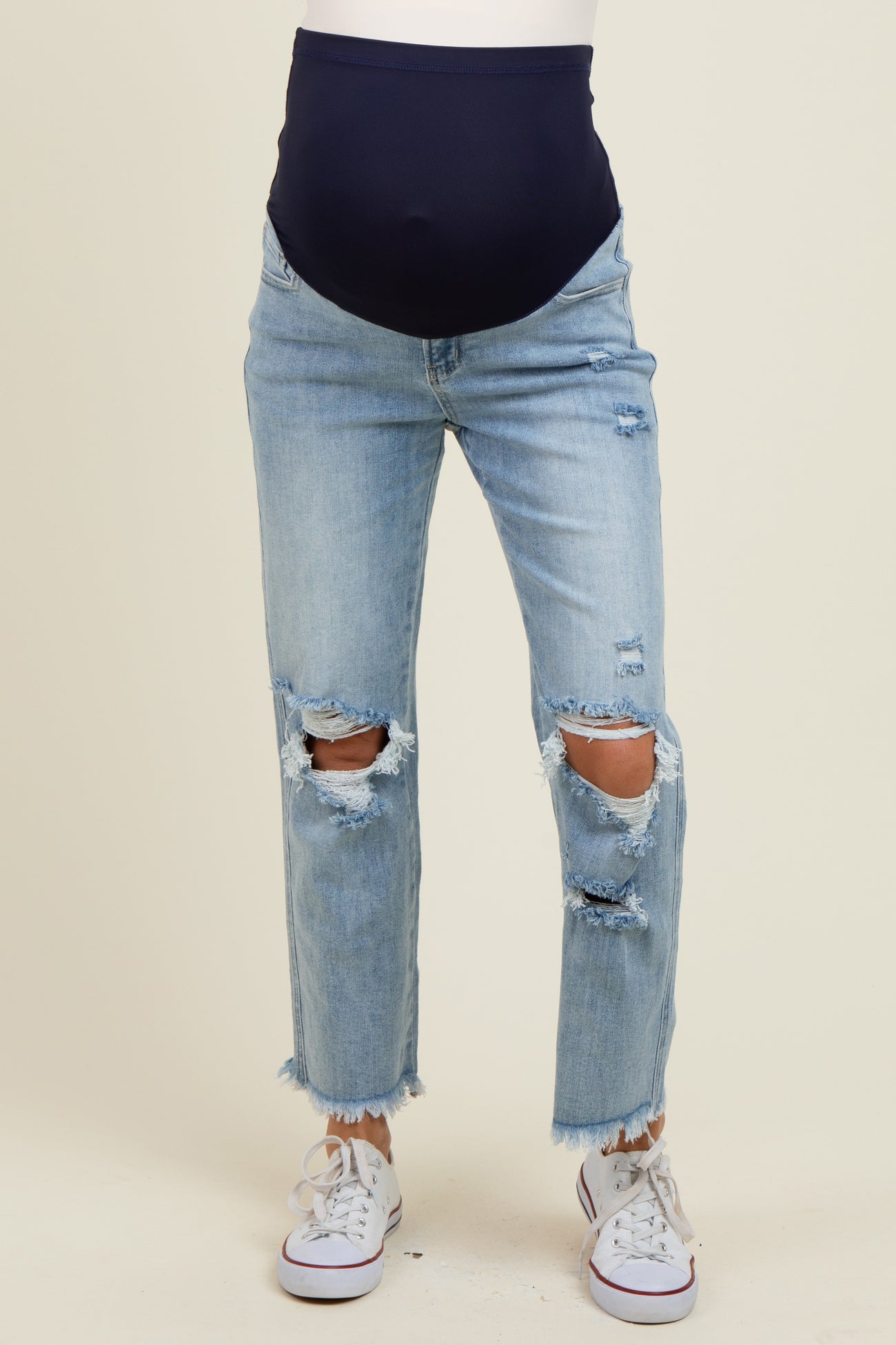 maternity wear navy blue high-waisted jeans with distressed details and visible baby bump