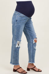 woman wearing distressed light blue maternity jeans with a navy blue over-the-bump waistband and a visible baby bump