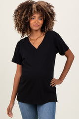 woman wearing a black maternity t-shirt with a v-neck and a visible baby bump