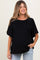 woman wearing a black maternity top with short sleeves and a relaxed fit, smiling and posing with one hand in her pocket