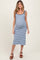 woman wearing a blue and white striped maternity dress that highlights her baby bump
