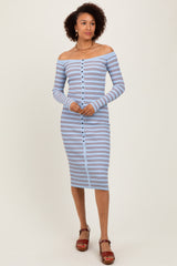 woman wearing a striped off-the-shoulder midi dress with long sleeves and buttons down the front