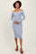 woman wearing a striped off-the-shoulder midi dress with long sleeves and buttons down the front