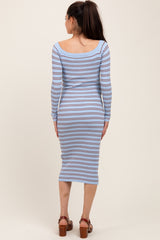 woman wearing a light blue striped maternity dress with long sleeves and a fitted midi length, seen from the back