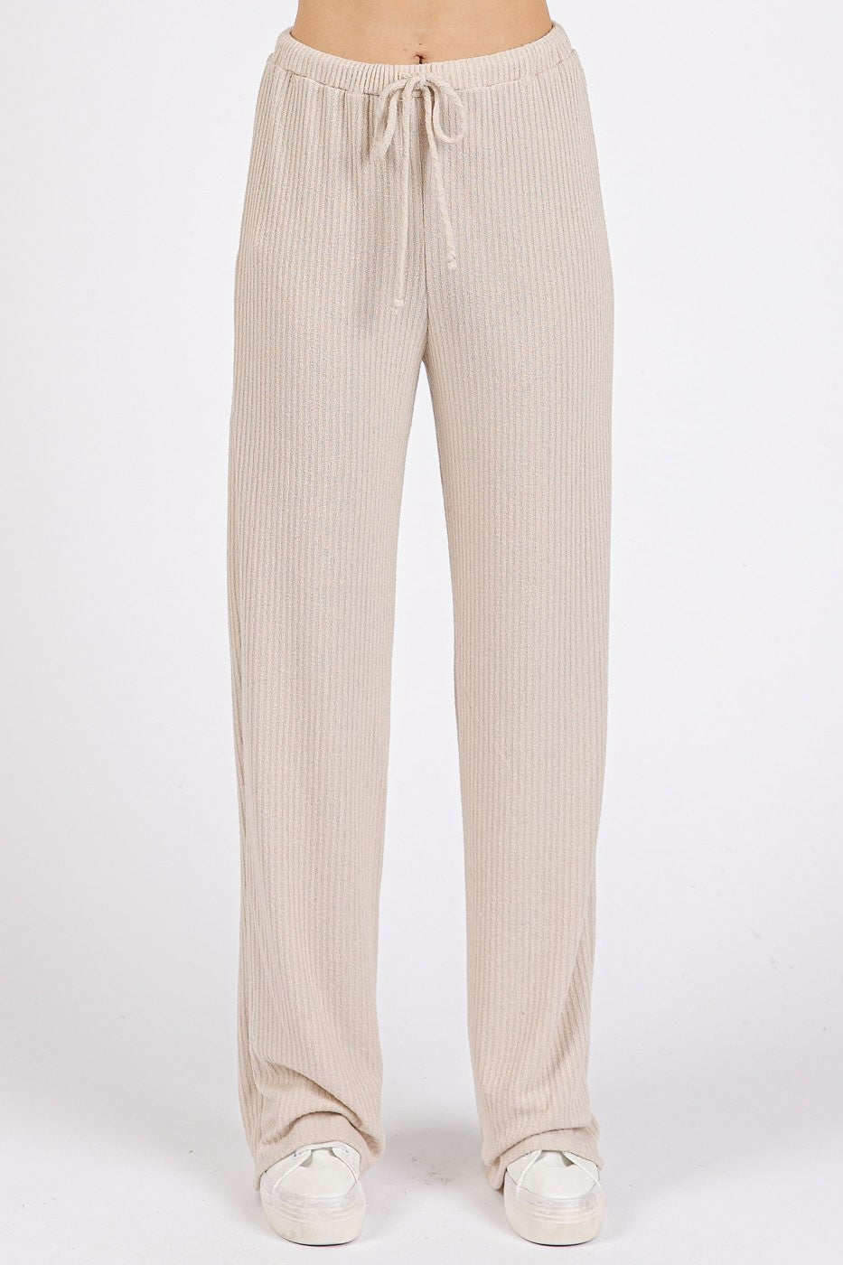 woman wearing beige ribbed wide-leg pants with drawstring waistband