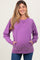 woman wearing a purple maternity sweatshirt with side pockets and a relaxed fit, showcasing her baby bump