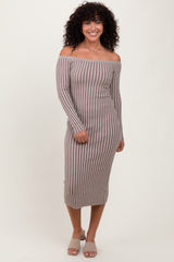 woman wearing a brown and white striped off-the-shoulder midi dress with long sleeves and side button details