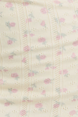 light beige fabric with a pink and blue floral pattern and delicate textured detailing