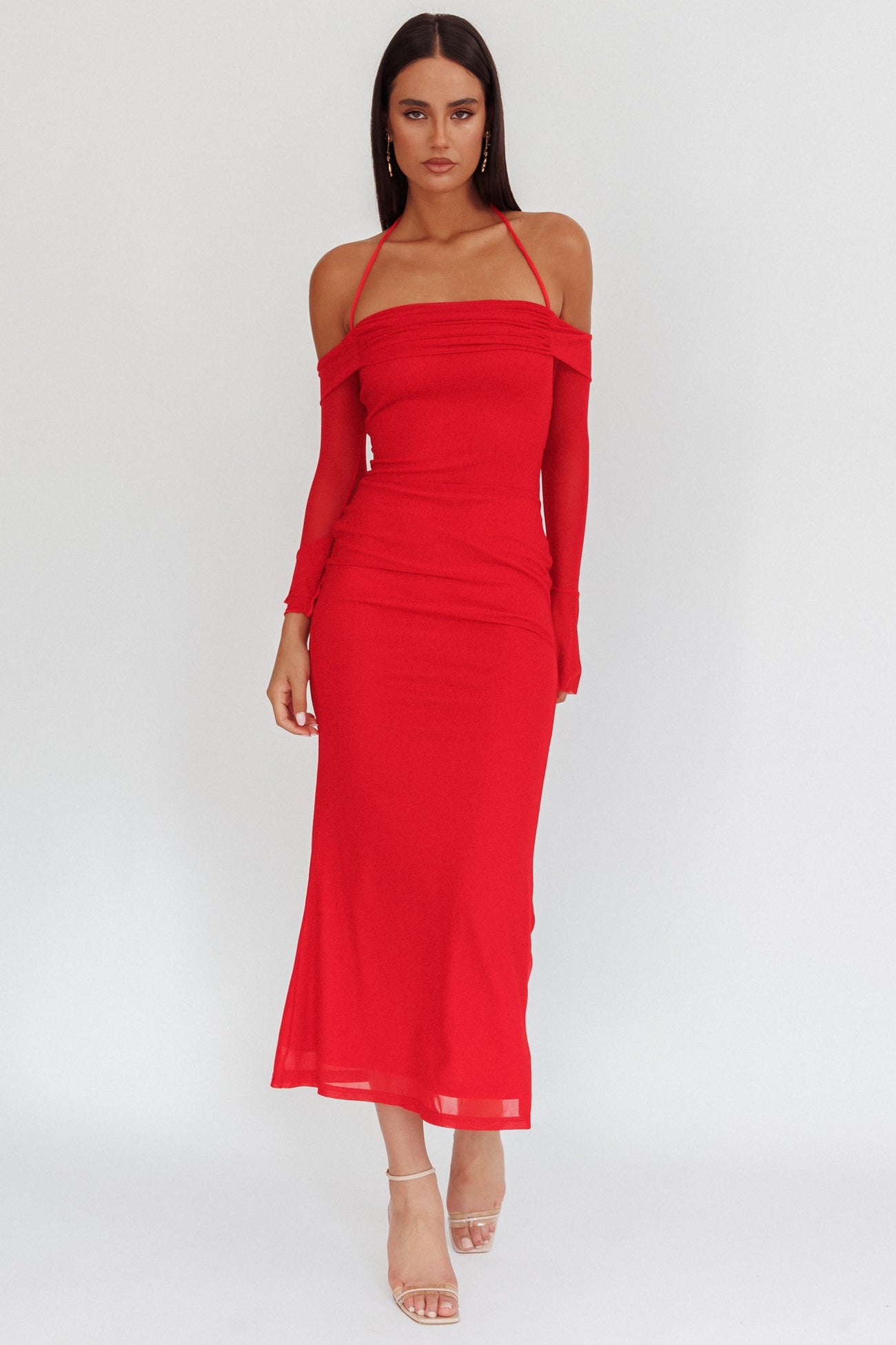 woman wearing a red off-the-shoulder midi dress with long sleeves and fitted silhouette