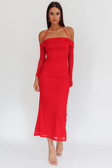 woman wearing a red off-the-shoulder midi dress with long sleeves and fitted silhouette