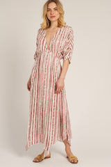 woman wearing a white and red striped maxi dress with a deep v-neck and short sleeves