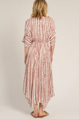 woman wearing a white and red striped maxi dress with a high-low hem and tied waist, shown from the back