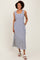 woman wearing a blue and white striped sleeveless maxi dress with an elastic waist and side pockets