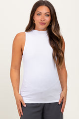 woman wearing a white sleeveless maternity top with a high neck and fitted style