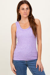 woman wearing a lavender ribbed tank top with a scoop neckline and casual fit, paired with blue jeans