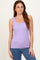 woman wearing a lavender ribbed tank top with a scoop neckline and casual fit, paired with blue jeans