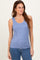 woman wearing a light blue ribbed tank top styled with medium wash jeans