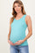 woman wearing a light teal ribbed maternity tank top and holding her baby bump