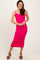 woman wearing a bright pink ribbed knit midi dress with spaghetti straps and brown platform sandals
