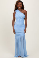 woman wearing a one-shoulder light blue evening gown featuring ruched details and a flowing skirt