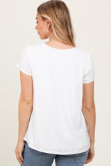woman wearing a white short sleeve t-shirt, viewed from the back, paired with blue jeans