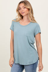 woman wearing a soft blue short sleeve t-shirt with a front pocket and relaxed fit paired with light blue jeans