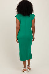 woman wearing a green midi dress with cap sleeves and a fitted silhouette, shown from the back