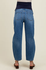 woman wearing light blue maternity jeans with a high waistband, seen from the back