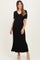 woman wearing a black ribbed maternity maxi dress with short sleeves and a tie waist detail