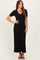 woman wearing a black short sleeve ribbed maxi dress with a drawstring waist and a v-neckline