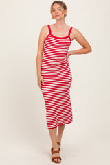 woman wearing a red and white striped midi dress with spaghetti straps
