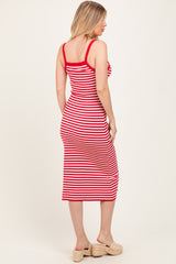 woman wearing a red and white striped maternity dress with a fitted silhouette and mid-calf length