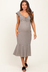 woman wearing a striped maternity dress with ruffled sleeves and a flared hem, featuring a tie detail at the neckline