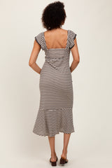 woman wearing a striped midi dress with short sleeves and a flared hem, viewed from the back