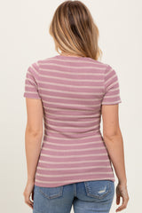 woman wearing a pink striped ribbed t-shirt with a fitted silhouette and short sleeves, seen from the back