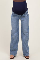 maternity wear featuring a pair of flared blue jeans with a navy supportive belly band